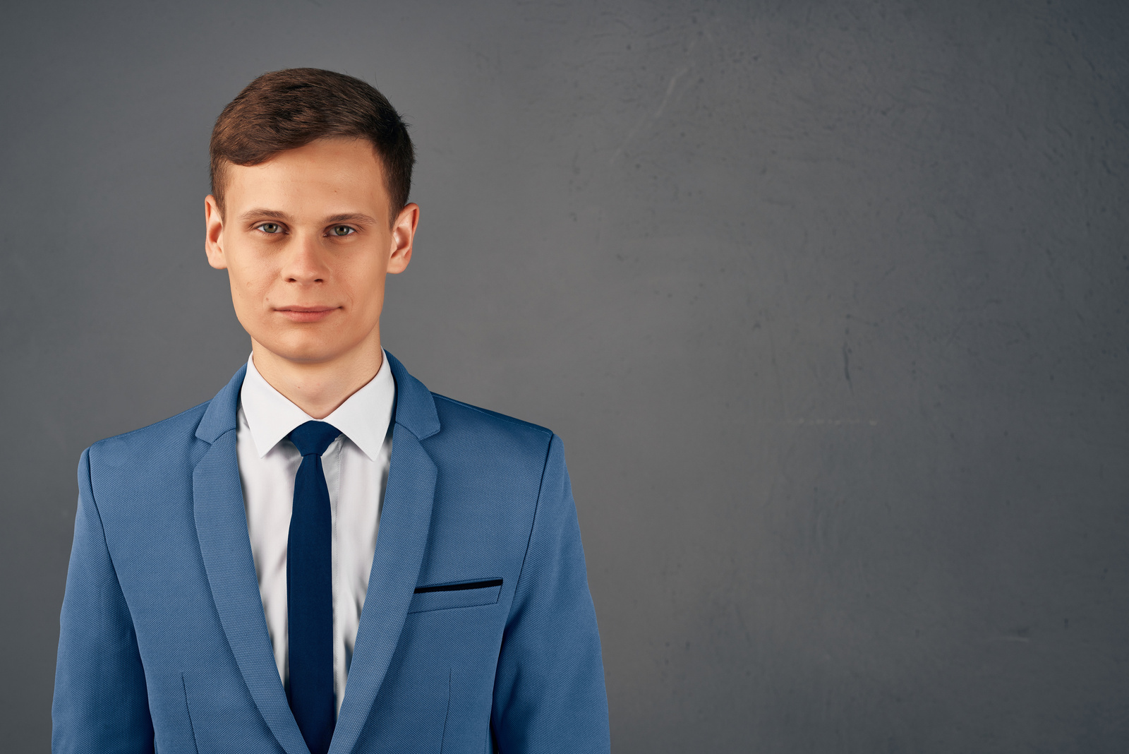 Business Man in a Suit Straightens His Tie Office Work